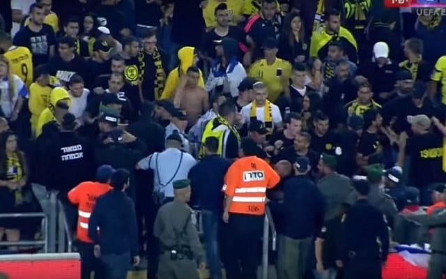 Fans of the Beitar Jerusalem soccer club fighting with police in the stands at Jerusalem's Teddy Stadium on May 1, 2016. (screen capture: YouTube/ONE) Fans of the Beitar Jerusalem soccer club fighting with police in the stands at Jerusalem's Teddy Stadium on May 1, 2016. (screen capture: YouTube/ONE)