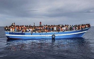 Italian coast guard rescues migrants off the coast of Sicily, May 12, 2016. (Italian Navy/Massimo Sestini via UNHCR Italia)