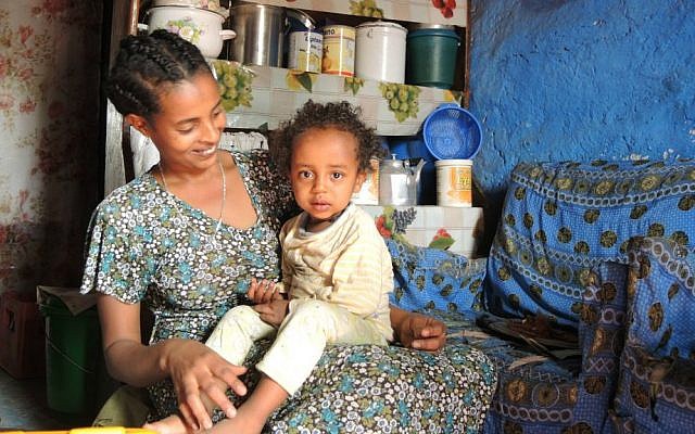 Alementu Lake, 25, a drink seller who lives near the center of Gondar, with her two-year-old daughter, Habtam, on April 15, 2016. (Melanie Lidman/Times of Israel)