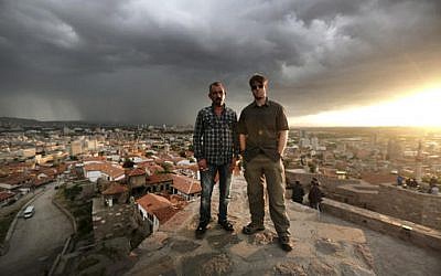 This June 2015 photo provided by Spencer Millsap shows Chase Millsap, right, and the Captain, posing for a photo in Ankara, Turkey. (Spencer Millsap/National Geographic via AP)