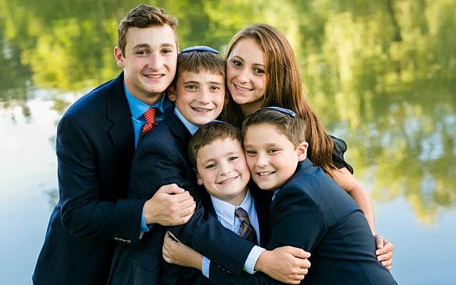 Ezra Schwartz, far left, was murdered by a Palestinian terrorist south of Jerusalem on November 19, 2015. At the time, Schwartz was spending a gap year at a Beit Shemesh yeshiva. Here he poses with his four younger siblings in Sharon, Massachusetts. (Facebook)