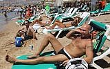 Illustrative photo of Israelis relaxing on the beach in the southern city of Eilat. (Nati Shohat/Flash90)