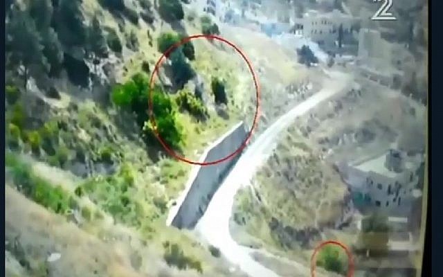 Security footage shows arson suspect fleeing area near Ofrit military base outside Jerusalem after bushes catch fire, May 14, 2016. (Channel 2 screenshot)