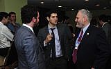 Chanan Weissman, center, speaking with Jewish Federations Washington director William Daroff, right, and Jordan Hirsch. (Ron Sachs from CNP/Courtesy of Jewish Insider)