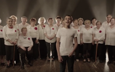 Uziya Zadok and the Amcha Choir, singing Yehuda Poliker and Ya'akov Gilad's song, 'When You Grow Up,' as part of a fundraising campaign created by the International Fellowship of Christians and Jews for Holocaust Remembrance Day 2016 (Courtesy YouTube screengrab)