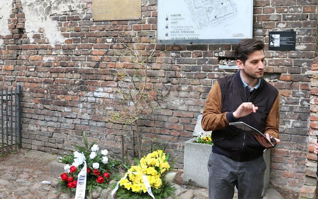 Polish tour guide Kuba Wesolowski at a surviving wall of the Warsaw ghetto. (Shmuel Bar-Am)