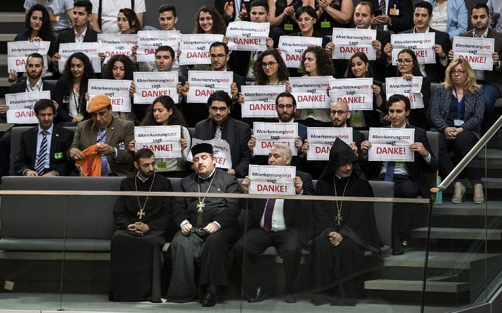 Armenian clergy men and activists react after lawmakers voted to recognize the Armenian genocide after a debate during the 173rd sitting of the Bundestag, the German lower house of parliament, Berlin, June 2, 2016. (AFP/ODD ANDERSEN)