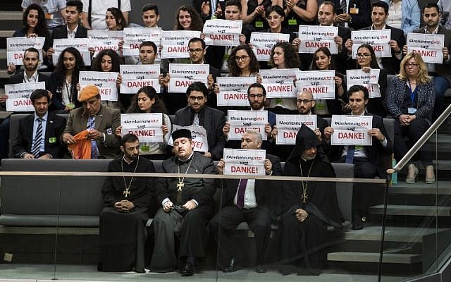 Armenian clergy men and activists react after lawmakers voted to recognize the Armenian genocide after a debate during the 173rd sitting of the Bundestag, the German lower house of parliament, Berlin, June 2, 2016. (AFP/ODD ANDERSEN) Armenian clergy men and activists react after lawmakers voted to recognize the Armenian genocide after a debate during the 173rd sitting of the Bundestag, the German lower house of parliament, Berlin, June 2, 2016. (AFP/ODD ANDERSEN)