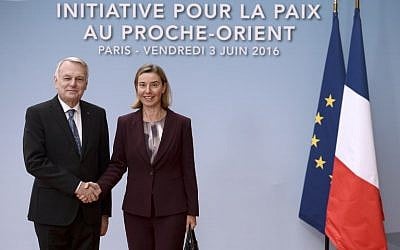 European Union High Representative for Foreign Affairs, Federica Mogherini, right, is welcomed by French Foreign minister Jean-Marc Ayrault prior to an international and interministerial meeting in a bid to revive the Israeli-Palestinian peace process, in Paris, on June 3, 2016. (AFP/Pool/Stephane de Sakutin)