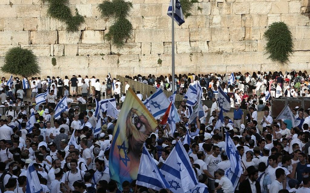 Israelis gather at the Western Wall in Jerusalem's Old City on June 5, 2016 with flags to celebrate Jerusalem Day, which marks Israel's victory in the 1967 Six Day War. (Menahem Kahana/AFP) Israelis gather at the Western Wall in Jerusalem's Old City on June 5, 2016 with flags to celebrate Jerusalem Day, which marks Israel's victory in the 1967 Six Day War. (Menahem Kahana/AFP)