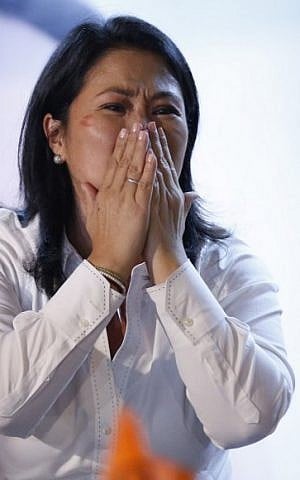 Keiko Fujimori of the Fuerza Popular party reacts during a brief appearance in front of supporters at her party's headquarters in a local hotel as news arrives that the polls have turned against her, in favor of her rival Pedro Pablo Kuzcynski (AFP PHOTO / LUKA GONZALES) Keiko Fujimori of the Fuerza Popular party reacts during a brief appearance in front of supporters at her party's headquarters in a local hotel as news arrives that the polls have turned against her, in favor of her rival Pedro Pablo Kuzcynski (AFP PHOTO / LUKA GONZALES)