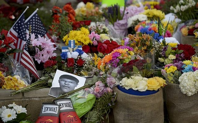 Flowers and memorabilia are seen at a memorial for boxing legend Muhammad Ali at the Mohammad Ali Center June 6, 2016 in Louisville, Kentucky. (AFP/ Brendan Smialowski) Flowers and memorabilia are seen at a memorial for boxing legend Muhammad Ali at the Mohammad Ali Center June 6, 2016 in Louisville, Kentucky. (AFP/ Brendan Smialowski)