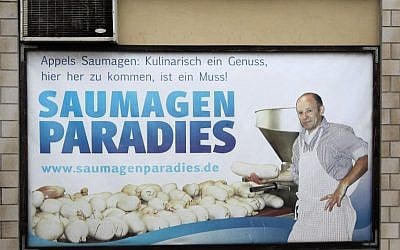An advertising poster reading 'pig stomach paradise' (Saumagenparadies) is pictured in the village of Kallstadt, southern Germany, on June 8, 2016. (AFP PHOTO / DANIEL ROLAND)