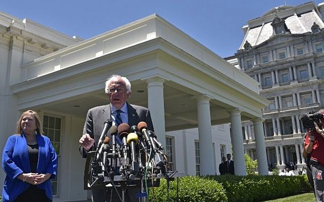 Democratic presidential candidate Bernie Sanders speaks to the press outside of the West Wing, as his wife Jane O'Meara Sanders looks on, following a meeting with US President Barack Obama on June 9, 2016 at the White House in Washington, DC. (AFP PHOTO/Mandel Ngan) Democratic presidential candidate Bernie Sanders speaks to the press outside of the West Wing, as his wife Jane O'Meara Sanders looks on, following a meeting with US President Barack Obama on June 9, 2016 at the White House in Washington, DC. (AFP PHOTO/Mandel Ngan)