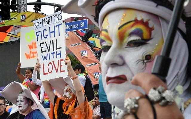 Participants show their support for victims of the Orlando shooting during the 2016 Gay Pride Parade on June 12, 2016 in Los Angeles, California. (Mark Ralston/AFP) Participants show their support for victims of the Orlando shooting during the 2016 Gay Pride Parade on June 12, 2016 in Los Angeles, California. (Mark Ralston/AFP)