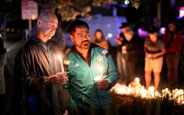 Mourners pay tribute to the victims of the Orlando shooting during a memorial service in San Diego, California on June 12, 2016. (AFP PHOTO / Sandy Huffaker) Mourners pay tribute to the victims of the Orlando shooting during a memorial service in San Diego, California on June 12, 2016. (AFP PHOTO / Sandy Huffaker)