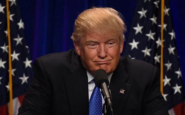 Republican presidential candidate Donald J. Trump speaks at the Saint Andelm College New Hampshire Institute of Politics in Manchester, New Hampshire June 13, 2016. AFP / TIMOTHY A. CLARY)