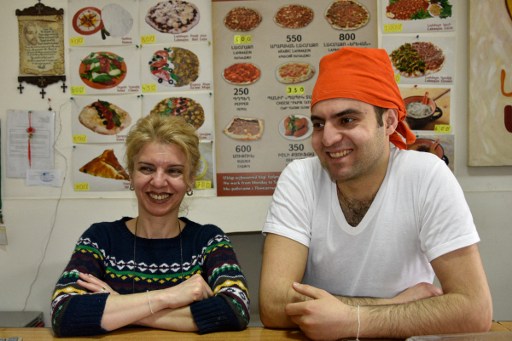 A picture taken on March 31, 2016 shows Salbi Jabakhchuryan and her son Kaits, who came from Aleppo in 2012, smiling during an interview with AFP in their restaurant in Yerevan. (AFP PHOTO / KAREN MINASYAN) A picture taken on March 31, 2016 shows Salbi Jabakhchuryan and her son Kaits, who came from Aleppo in 2012, smiling during an interview with AFP in their restaurant in Yerevan. (AFP PHOTO / KAREN MINASYAN)