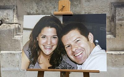 A picture taken on June 15, 2016 at the Ministry of Interior in Paris during a memorial ceremony shows a photograph of French policeman Jean-Baptiste Salvaing and his partner Jessica Schneider, who were killed on June 13 by a man claiming allegiance to the Islamic State group. (AFP Photo/Pool/Kamil Zihnioglu)