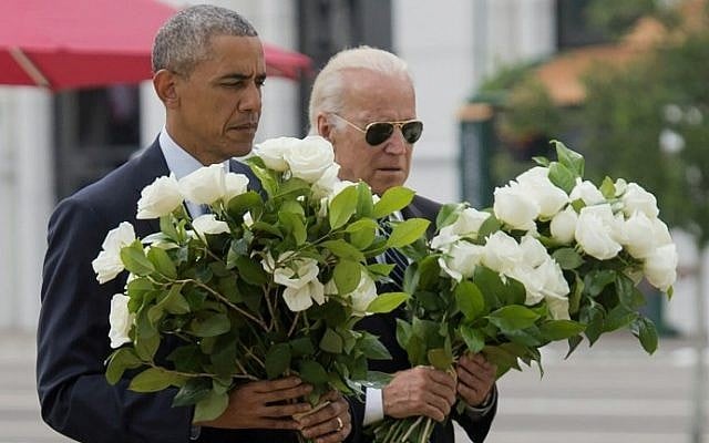 US President Barack Obama and Vice President Joe Biden place flowers for the victims of the mass shooting at a gay nightclub Sunday at a memorial at the Dr. Phillips Center for the Performing Arts in Orlando, Florida, June 16, 2016. (AFP/Saul Loeb) US President Barack Obama and Vice President Joe Biden place flowers for the victims of the mass shooting at a gay nightclub Sunday at a memorial at the Dr. Phillips Center for the Performing Arts in Orlando, Florida, June 16, 2016. (AFP/Saul Loeb)