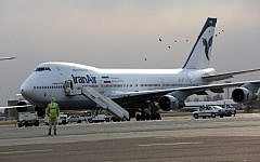 Illustrative: An Iran Air Boeing 747 passenger plane sitting on the tarmac of the domestic Mehrabad airport in the Iranian capital Tehran, January 15, 2013. (AFP/Behrouz Mehri)