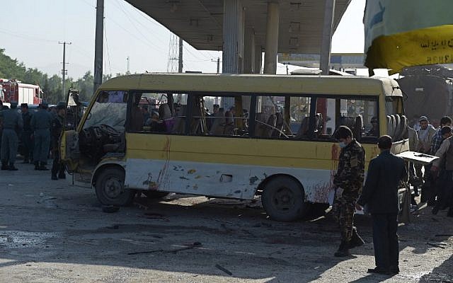 Afghan policemen look at the site of a suicide attack that hit a minibus carrying Nepalese security guards in Kabul on June 20, 2016. (AFP/SHAH MARAI) Afghan policemen look at the site of a suicide attack that hit a minibus carrying Nepalese security guards in Kabul on June 20, 2016. (AFP/SHAH MARAI)