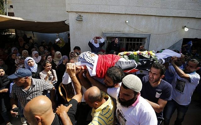 Mourners carry the body of 15-year-old Palestinian teenager Mahmoud Badran who was killed by Israeli troops on June 21, 2016, during his funeral in the village of Beit Ur-Tahta near the West Bank city of Ramallah on June 23, 2016. (AFP/Abbas Momani) Mourners carry the body of 15-year-old Palestinian teenager Mahmoud Badran who was killed by Israeli troops on June 21, 2016, during his funeral in the village of Beit Ur-Tahta near the West Bank city of Ramallah on June 23, 2016. (AFP/Abbas Momani)