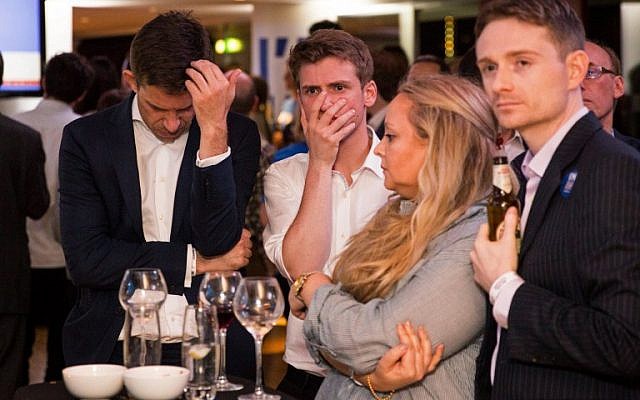 Supporters of the 'Stronger In' Campaign react as results of the EU referendum are announced at a results party at the Royal Festival Hall in London early in the morning of June 24, 2016.(AFP PHOTO / POOL / ROB STOTHARD) Supporters of the 'Stronger In' Campaign react as results of the EU referendum are announced at a results party at the Royal Festival Hall in London early in the morning of June 24, 2016.(AFP PHOTO / POOL / ROB STOTHARD)