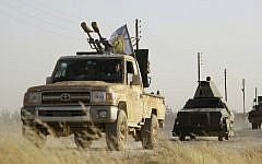 US-backed Kurdish and Arab fighters advance into the Islamic State's bastion of Manbij, in northern Syria, on June 23, 2016. (AFP/Delil Souleiman)