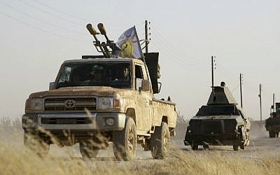 US-backed Kurdish and Arab fighters advance into the Islamic State (IS) jihadist's group bastion of Manbij, in northern Syria, on June 23, 2016. (Delil Souleiman/AFP) US-backed Kurdish and Arab fighters advance into the Islamic State (IS) jihadist's group bastion of Manbij, in northern Syria, on June 23, 2016. (Delil Souleiman/AFP)