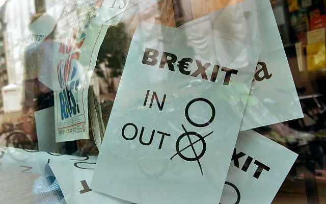 A poster featuring a Brexit vote ballot with "out" tagged is on display at a book shop window in Berlin on June 24, 2016. (John MacDougall/AFP)