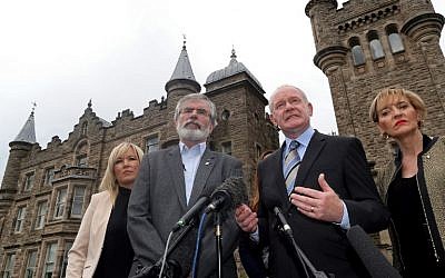 Sinn Fein leader Gerry Adams (L) and Sinn Fein politician and Northern Ireland's Deputy First Minister, Martin Mcguinness (2R) speak during a press conference outside Stormont Castle in Belfast, Northern Ireland on June 24, 2016, after the United Kingdom's June 23 referendum in which voters chose to leave the European Union. (AFP Photo/Paul Faith)