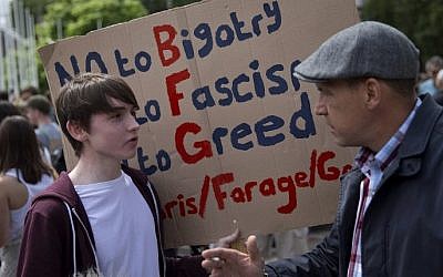 A demonstrator holds a placard during a protest against the pro-Brexit outcome of the UK's referendum on the European Union, in central London on June 25, 2016. (AFP/JUSTIN TALLIS)