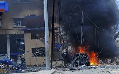 Fire is seen at the scene of a car bomb attack claimed by al-Qaeda-affiliated Shabab militants  on June 25, 2016. (AFP Photo/Mohamed Abdiwahab)