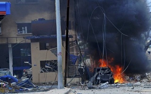 Fire is seen at the scene of a car bomb attack claimed by al-Qaeda-affiliated Shabab militants on June 25, 2016. (AFP Photo/Mohamed Abdiwahab) Fire is seen at the scene of a car bomb attack claimed by al-Qaeda-affiliated Shabab militants on June 25, 2016. (AFP Photo/Mohamed Abdiwahab)