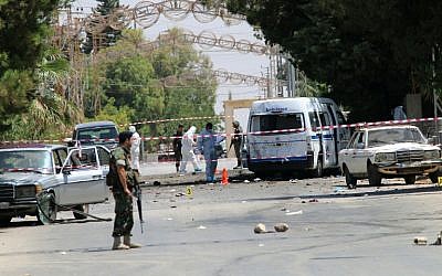 Lebanese security forces secure the site of multiple suicide bombings which took place early on June 27, 2016 in the predominantly Christian village of Al-Qaa, in eastern Lebanon near the border with Syria. (AFP/ STRINGER)