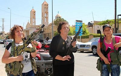Lebanese Christian women hold weapons as residents of the Christian village of al-Qaa, near the Lebanon's border with war-ravaged Syria, secure the area on June 28, 2016 after two waves of suicide bombings struck the village killing and wounding several people. (AFP PHOTO/STRINGER) Lebanese Christian women hold weapons as residents of the Christian village of al-Qaa, near the Lebanon's border with war-ravaged Syria, secure the area on June 28, 2016 after two waves of suicide bombings struck the village killing and wounding several people. (AFP PHOTO/STRINGER)