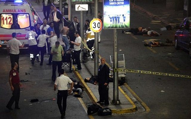 This picture obtained from the Ilhas News Agency shows an ambulance and emergency workers intervening next to people lying on the ground (R), after two explosions followed by gunfire hit the Turkey's biggest airport of Ataturk in Istanbul, on June 28, 2016. AFP/ ILHAS NEWS AGENCY) This picture obtained from the Ilhas News Agency shows an ambulance and emergency workers intervening next to people lying on the ground (R), after two explosions followed by gunfire hit the Turkey's biggest airport of Ataturk in Istanbul, on June 28, 2016. AFP/ ILHAS NEWS AGENCY)