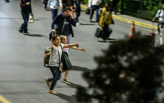 Children run to their relatives as they leave Ataturk Airport on June 28, 2016 in Istanbul after two explosions followed by gunfire hit Turkey's biggest airport. (Ozan Kose/AFP)