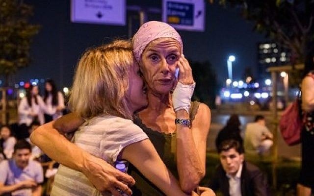 Passengers embrace outside Ataturk airport`s main entrance in Istanbul, on June 28, 2016, after a suicide attack left at least 36 people dead. (AFP/ OZAN KOSE) Passengers embrace outside Ataturk airport`s main entrance in Istanbul, on June 28, 2016, after a suicide attack left at least 36 people dead. (AFP/ OZAN KOSE)