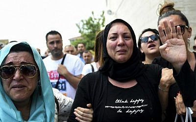 The daughter, right, of Siddik Turgan, a man who was killed in the June 28, 2016 Ataturk Airport attack, reacts as her father's coffin is carried during his funeral ceremony on June 29, 2016 in Istanbul. (Bulent Kilic/AFP)