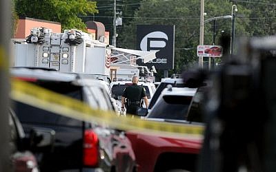 Orlando police officers seen outside of Pulse nightclub after a fatal shooting and hostage situation on June 12, 2016 in Orlando, Florida. The suspect was shot and killed by police after 50 people died and 53 were injured. (Gerardo Mora/Getty Images/AFP)