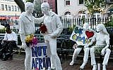 Tribute signs are placed on statues depicting homosexual couples in a park near the Stonewall Inn where a vigil was held in New York City following the massacre that occurred at a gay Orlando nightclub on June 12, 2016. Monika Graff/Getty Images/AFP)