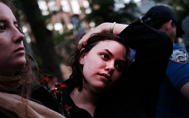 Mourners gather outside of the iconic New York City gay and lesbian bar The Stonewall Inn on June 12, 2016 to light candles, lay flowers and grieve for those killed in Orlando early Sunday. (Spencer Platt/Getty Images/AFP) Mourners gather outside of the iconic New York City gay and lesbian bar The Stonewall Inn on June 12, 2016 to light candles, lay flowers and grieve for those killed in Orlando early Sunday. (Spencer Platt/Getty Images/AFP)