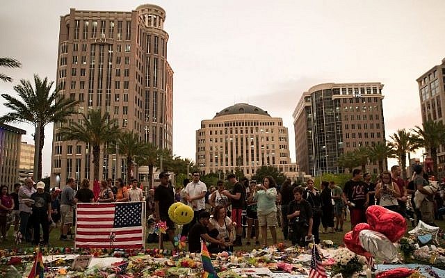 People visit a memorial for the victims of the Pulse Nightclub shooting, at the Dr. Phillips Center for Performing Arts, June 14, 2016 in Orlando, Florida. (Drew Angerer/Getty Images/AFP)
