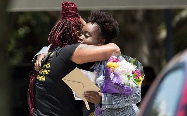Mourners arrive for the viewing and funeral service Kimberly Morris, June 16, 2016 in Kissimmee, Florida. Morris, who worked as a bouncer at the Pulse Nightclub, was killed in the June 12 shooting. (Drew Angerer/Getty Images/AFP)