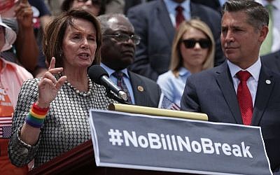 US House Minority Leader Rep. Nancy Pelosi (D-CA) (L) speaks as Assistant Minority Leader Rep. James Clyburn (D-SC) (2nd L), and Brady Campaign president Dan Gross (R) listen during a news conference on gun control June 22, 2016 on Capitol Hill in Washington, DC. (Alex Wong/Getty Images/AFP)