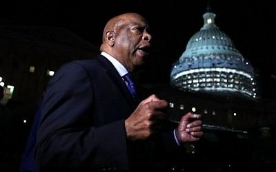 US Rep. John Lewis (D-GA) speaks to gun control activists who gather outside the Capitol after House Republicans have forced votes as House Democrats stages a sit-in on the House floor June 22, 2016 on Capitol Hill in Washington, DC. (Alex Wong/Getty Images/AFP)