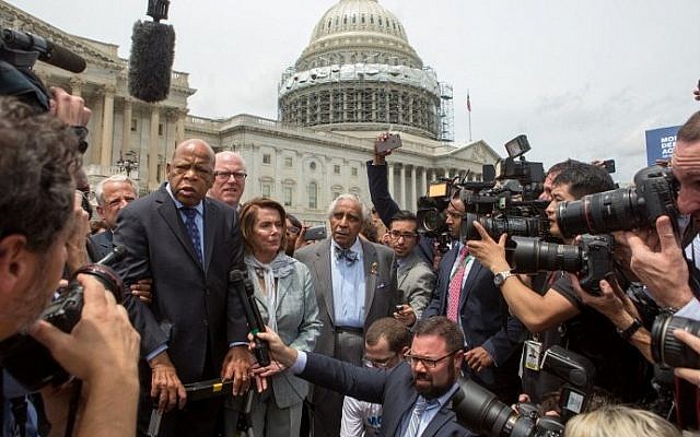Rep. John Lewis (D-GA), left, Minority Leader Nancy Pelosi (D-CA), center, and Charles Rangel, (D-NY), right, speak with supporters outside the U.S. Capitol building June 23, 2016. (Allison Shelley/Getty Images/AFP) Rep. John Lewis (D-GA), left, Minority Leader Nancy Pelosi (D-CA), center, and Charles Rangel, (D-NY), right, speak with supporters outside the U.S. Capitol building June 23, 2016. (Allison Shelley/Getty Images/AFP)