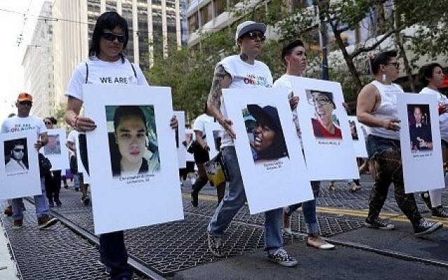 A group carries photos of victims of the Orlando nightclub shooting during the 2016 San Francisco Pride Parade on June 26, 2016 in San Francisco, California. ( Justin Sullivan/Getty Images/AFP) A group carries photos of victims of the Orlando nightclub shooting during the 2016 San Francisco Pride Parade on June 26, 2016 in San Francisco, California. ( Justin Sullivan/Getty Images/AFP)